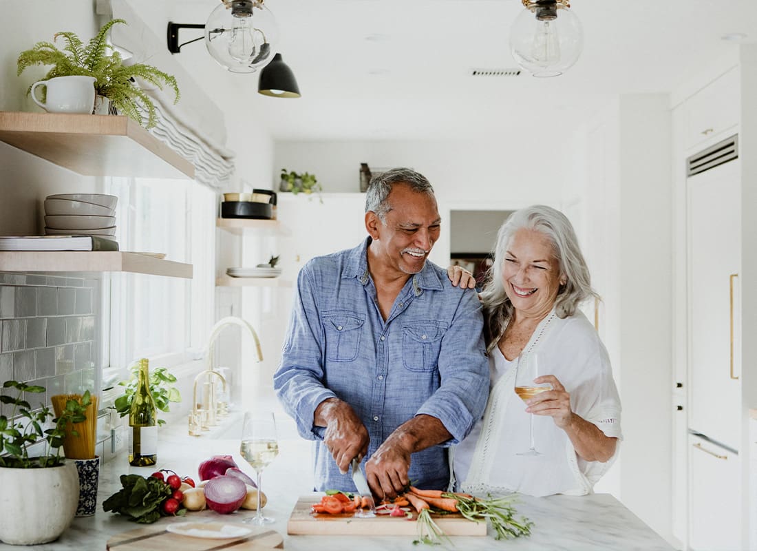 Medicare - Elderly Couple Cooking in the Kitchen Together